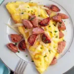 Omellette, hot dogs, baked beans ,salad