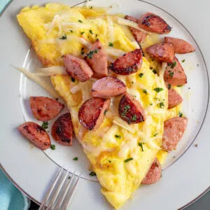 Omellette, hot dogs, baked beans ,salad
